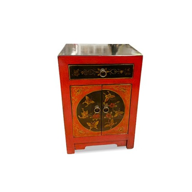Asian Red/Black Shanxi Hand Painted End Table is made out of elm wood. It has 2 doors, and 1 drawer, and 1 removable...