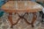 Amazing 1920s solid French walnut dining table in Louis XV style in a lovely medium walnut color, all hand carved with...