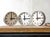 A factory wall clock by aeg from the 1960s in its original hammered grey paint, with a light dial, bold black bar markers,...