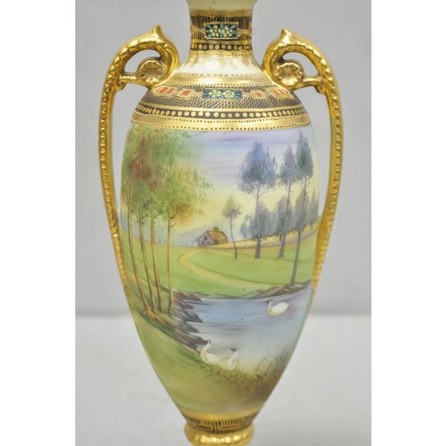 Early 20th Century Antique Nippon Hand Painted Twin Handled Gold Gilt Lake & Swan Scene Bolted Vase For Sale - Image 5 of 17