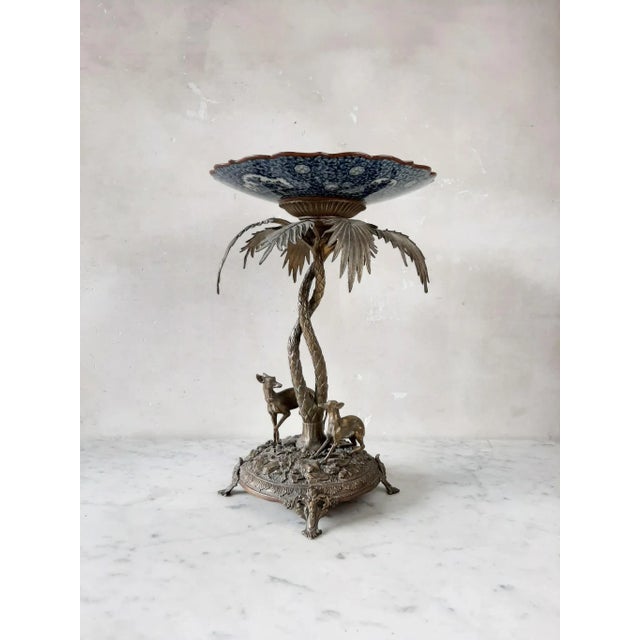 A beautiful detailed centerpiece, two whippets under a palm tree. A Villeroy & Boch plate in blue and white ceramic, above...