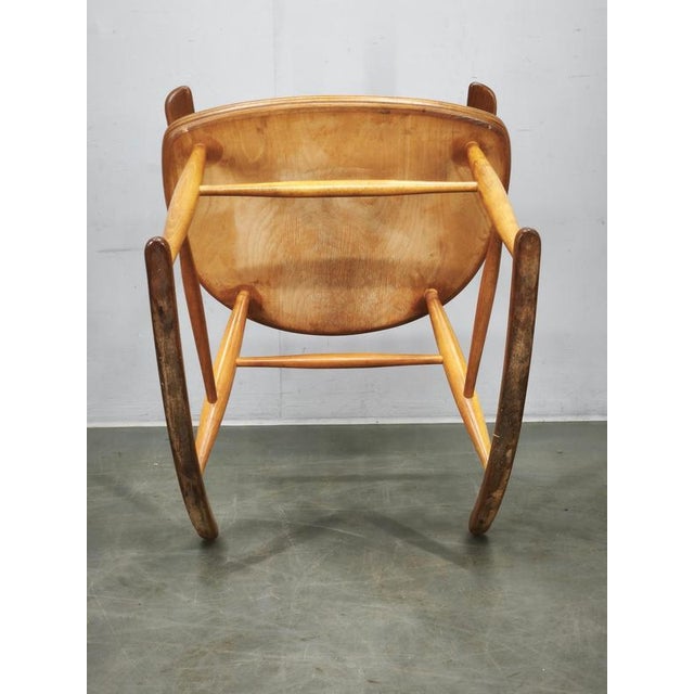 A sculptural Danish Modern rocking chair designed by Illum Wikkelsø and manufactured by Niels Eilersen in Denmark during...