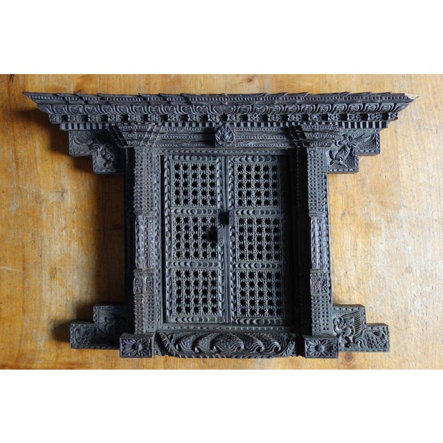 Antique Newari window, a traditional interior design element from Nepal, early 20th century. Handcrafted, finely carved...