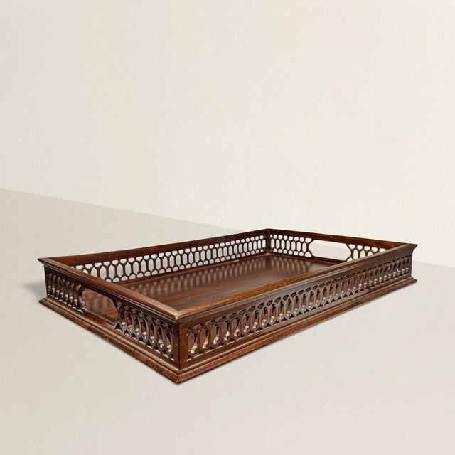 Let’s call it what it is: a quiet flirtation with Chippendale style, recast in teak and sharpened for a more modern eye....