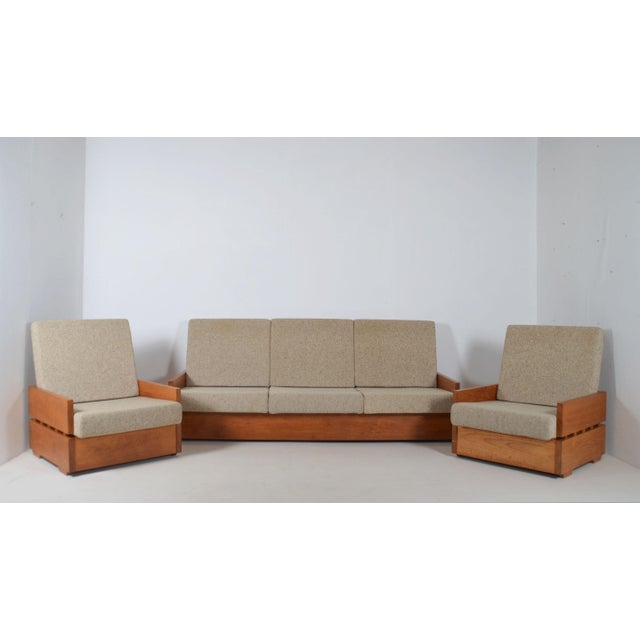Set of brutalist armchairs in solid wood from the 70s. This set consists of 2 x 1-seater and 1 x 3-seater. The seats come...