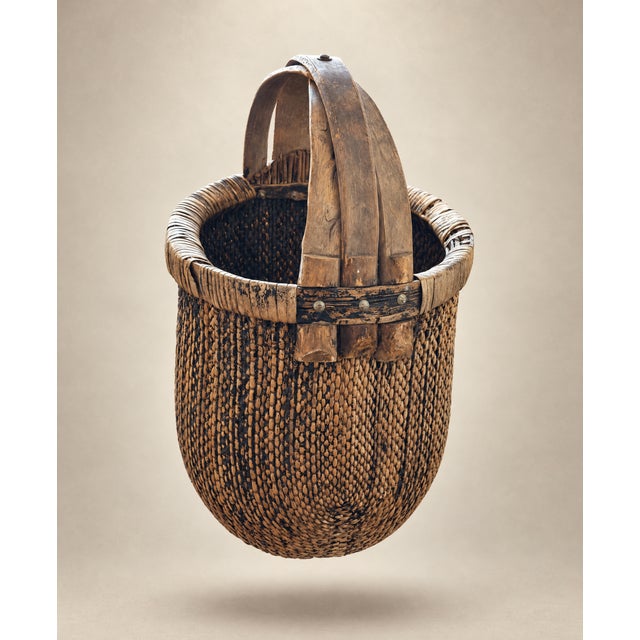 Early 20th Century Rice and Grain Woven Basket with Handle. Tradionally utilized to transport rice and grain. This lovely...