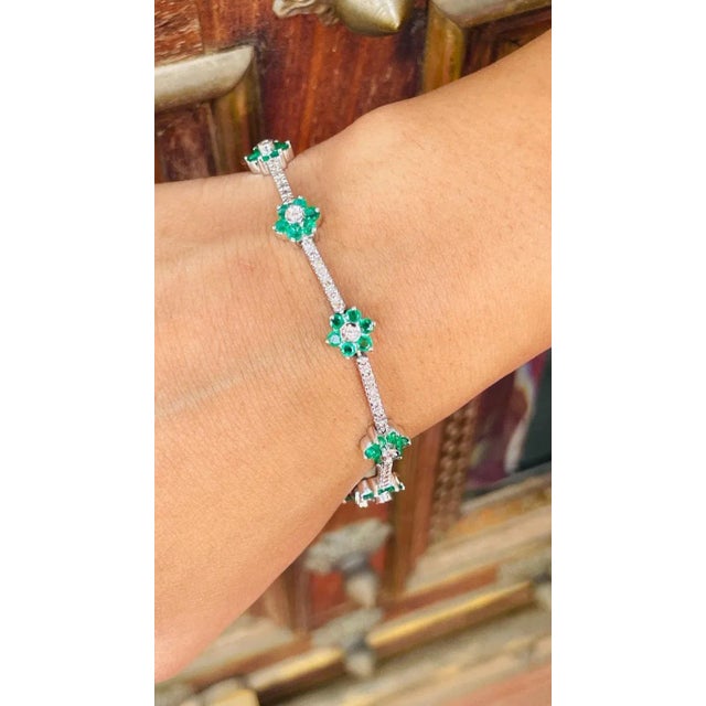 This is part of Chairish’s Fine Jewelry assortment. This Emerald Flower and Diamond Tennis Bracelet in 18K gold showcases...
