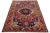 Beautiful Vintage Hand-knotted Persian Bakhtiari with a red field. This piece has a rosette motif with accents in navy...