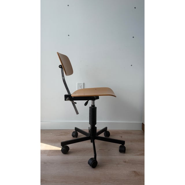Iconic Kevi desk chair by Danish designer Jorgen Rasmussen, with adjustable teak plywood seat and backrest and 5 star...