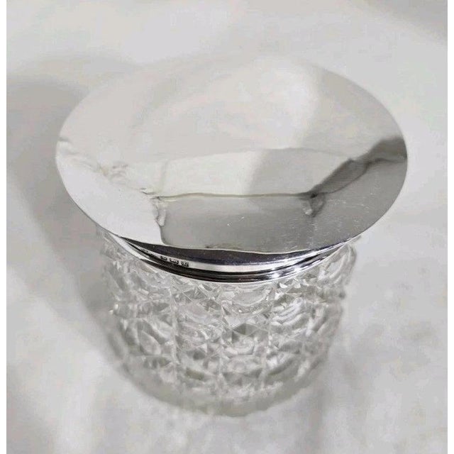 A fine george v period dressing table or vanity jar dating to 1918, combining beautifully cut glass with a sterling silver...