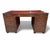Campaign style leather partner desk by Theodore Alexander. The top sides and drawers are all covered in tooled, whisky-...