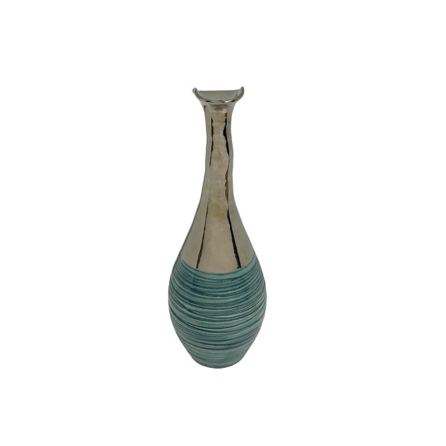 Showcase your unique style with this stunning 16-inch tall decorative vase. A perfect blend of modern design and organic...