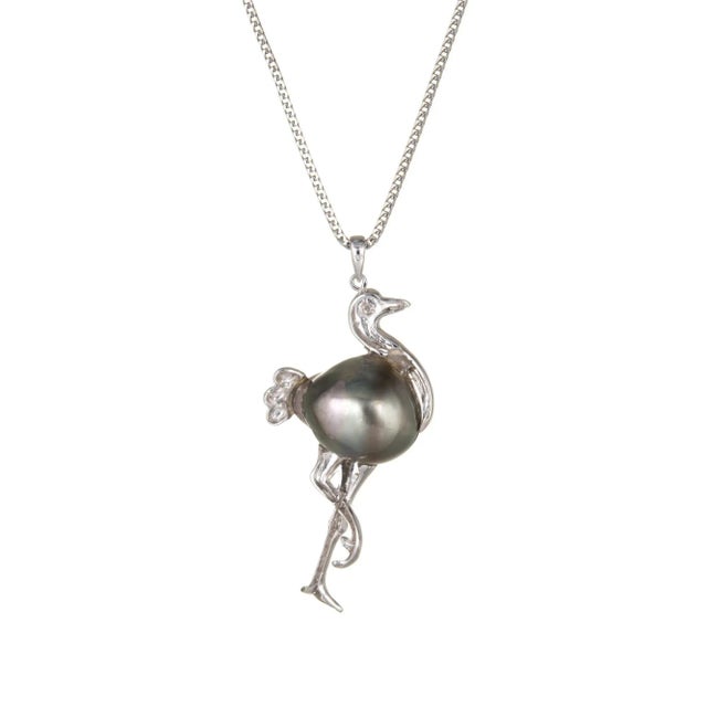 Stylish & unique stork pendant & necklace crafted in 14k white gold. Black baroque pearl measures 17mm x 13.5mm. One...