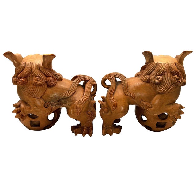 Vintage Pair of MCM Small Carved Wooden FOO DOGS Chinese Lion Statues featuring wooden balls in their mouths and puzzle...