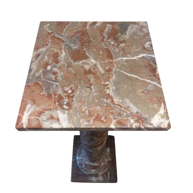 A striking and architecturally scaled Italian marble pedestal column crafted in richly veined breccia pernice marble. The...