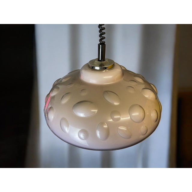 This lamp appears to be a late modernist / space age pendant lamp, probably dating from the 1970s to early 1980s. The...