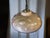 This lamp appears to be a late modernist / space age pendant lamp, probably dating from the 1970s to early 1980s. The...