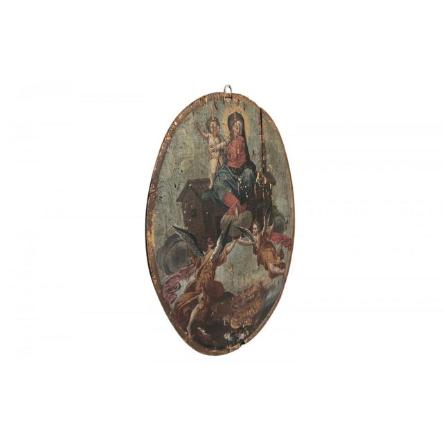 An outstanding and grand 17th century Baroque oil painting on an oval wooden panel of the Madonna and Child. Beautifully...