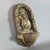 A fine and evocative terracotta wall-mounted holy water stoup, attributed to 20th-century devotional art. Subject and...