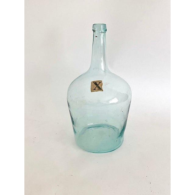Vintage French handblown aqua demijohn with applied mouth. Irregularities and imperfections are part of the charm of...