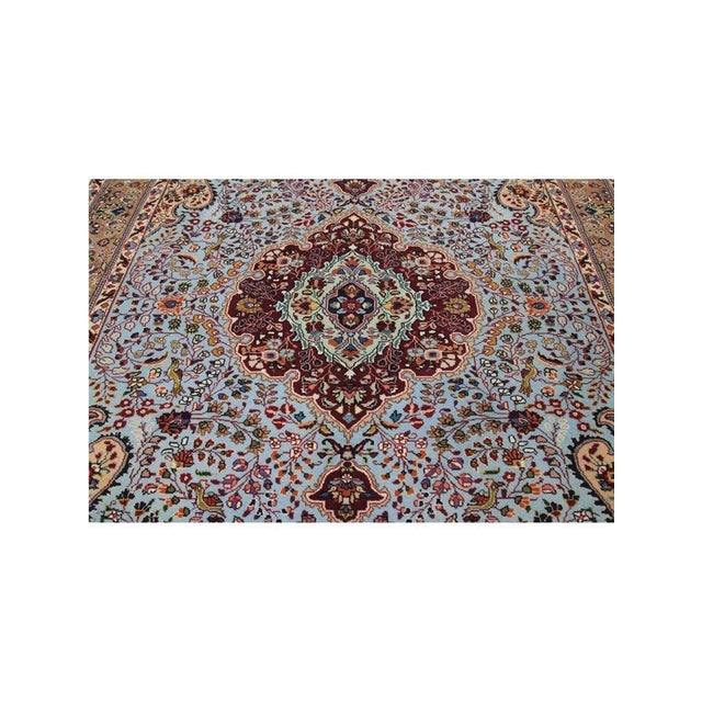 Exact Size: 4'7" x 6'9" Color: Blue Age: Old Materials: Wool, Natural Silk Construction: Hand Knotted