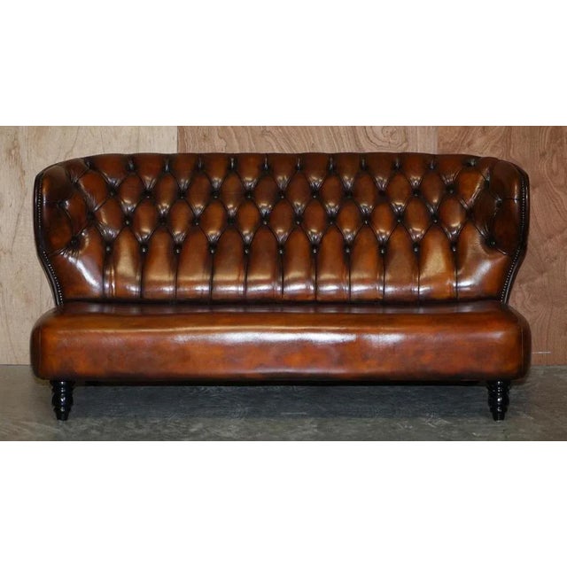 Stunning fully restored whiskey brown leather contemporary designer sofa. Where to begin! This sofa is absolute eye candy...