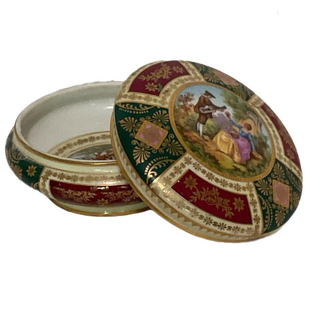 Josef Kuba Werkstätte (Josef Kuba Workshop) A beautiful round covered porcelain box decorated with ornate panels of...
