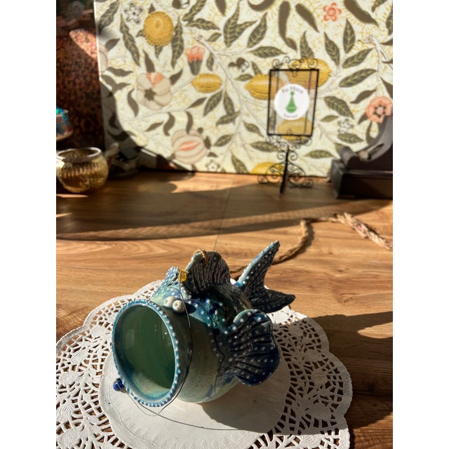 Up for consideration is a beautiful vintage blue ceramic fish bowl wall hanging. This would look lovely in your home and...