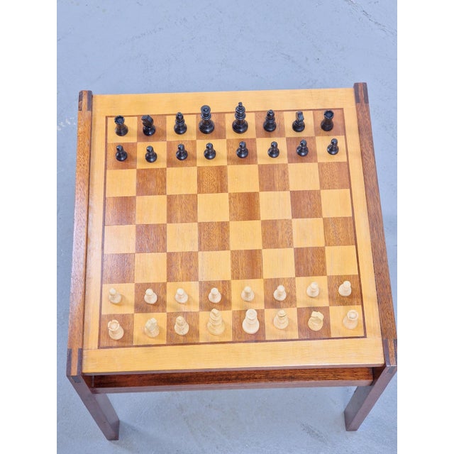 Beautiful vintage coffee table with chessboard. Produced in the 70s. The chessboard is inlaid with veneer of different...