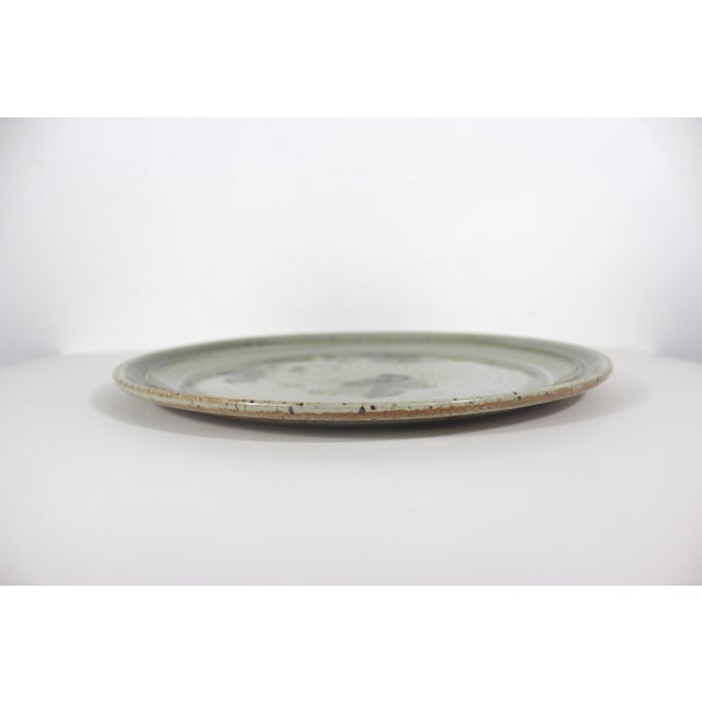 Vintage, signed, speckled studio stoneware pottery platter. Beautiful neutral gray tan tones with a subtle floral pattern....