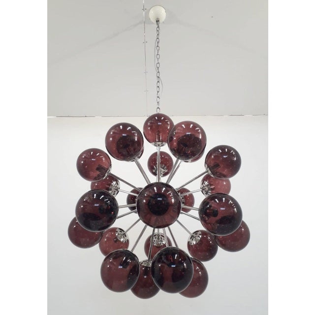 Italian sputnik chandelier with 24 amethyst Murano glass globes carefully hand blown with bubbles inside the glass using...