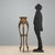 Barocchetto style plant stand crafted from carved, lacquered, and gilded wood, dating back to the early 20th century in...