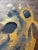 Original mid-century abstract painting on natural wood panel, rendered with textured impasto in metallic gold and deep...