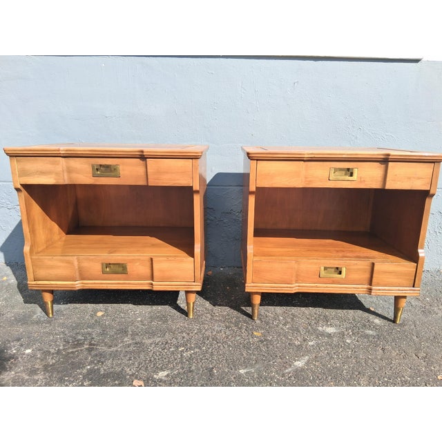 Pair 1940s Campaign style Nightstands by John Widdicomb. Lots of storage with 2 drawer and an open center area for...