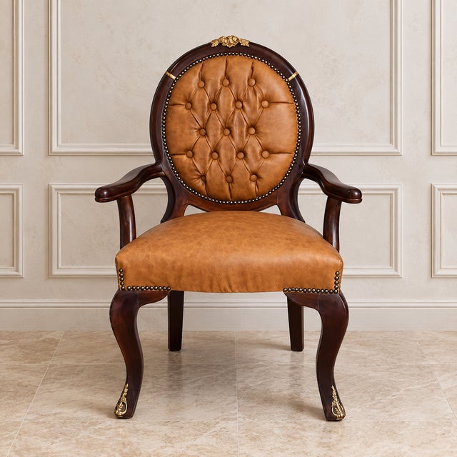 Make a bold statement with this luxurious French Empire style armchair, expertly crafted with rich cognac leather...