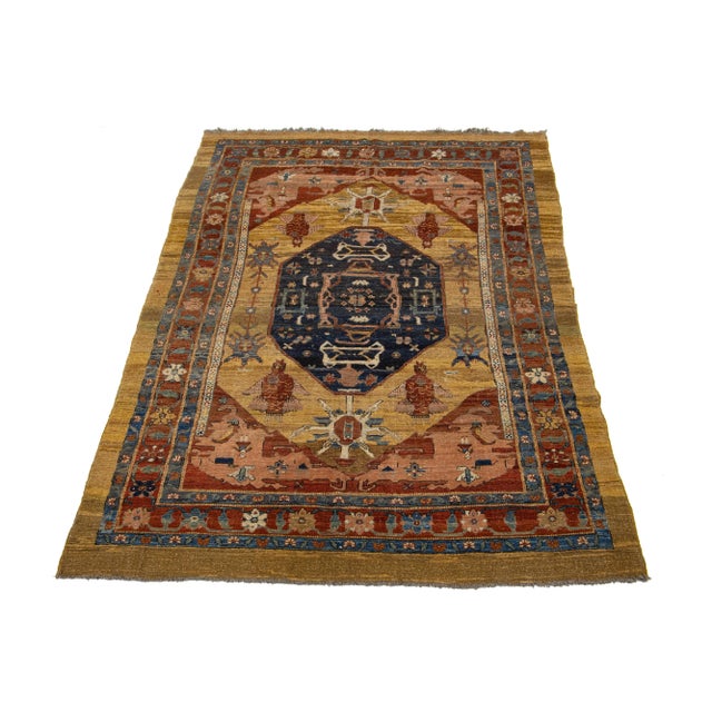 Beautiful vintage Bakshaish hand-knotted wool rug with a tan and brown color field. This Persian rug has the fame of rust,...