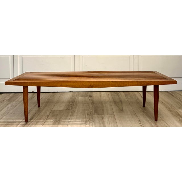Here is a vintage Yugoslavian Scandinavian Modern slatted wood bench dating to the 1970s. Crafted with a beautifully...