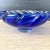 Heavy encased cobalt blue in clear glass blown candy dish with a nice simple crimped design around the rim. Catches light...