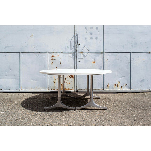 Pair of console tables with die-cast aluminum legs and a laminated wood top. Designed by George Nelson Manufactured by ICF...