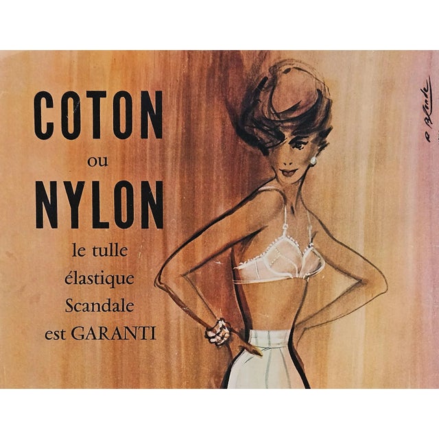 This is a 1958 Mid-Century French advertisement print for luxury lingerie, bras, girdles and hosiery by a French lingerie...