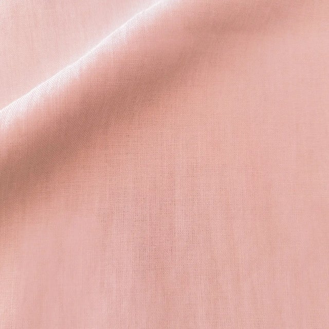 Fine peach/blush linen pillows with zipper closure and down insert. No cording. The color definitely has a lot of pink in...