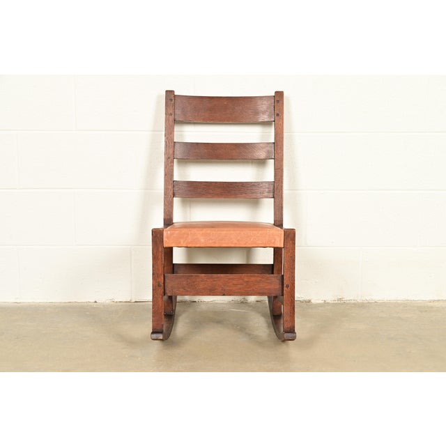 A gorgeous antique Mission or Arts & Crafts period rocking chair By L. & J.G. Stickley USA, Circa 1910 Quarter sawn oak,...