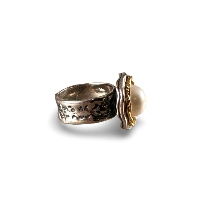 Sterling silver hand crafted Pearl ring, made in Israel. This Sterling ring also has a vermeil detail, with gold around...
