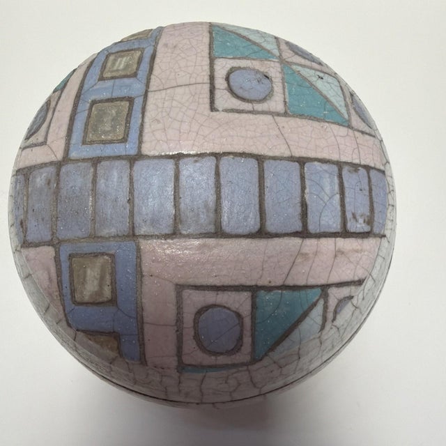 Here is a signed handmade raku-fired lidded bowl by American studio artist Gayle Whiteley Minjarez. This piece measures...