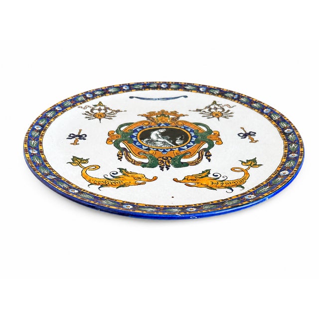 A striking late 19th-century French Gien Renaissance faience plate, likely circa 1899 , featuring the manufacture's...