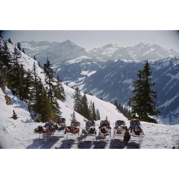Lounging in Gstaad 1961 Holidaymakers in sun loungers on the slopes at at Gstaad, Switzerland, March 1961. (Photo by Slim...