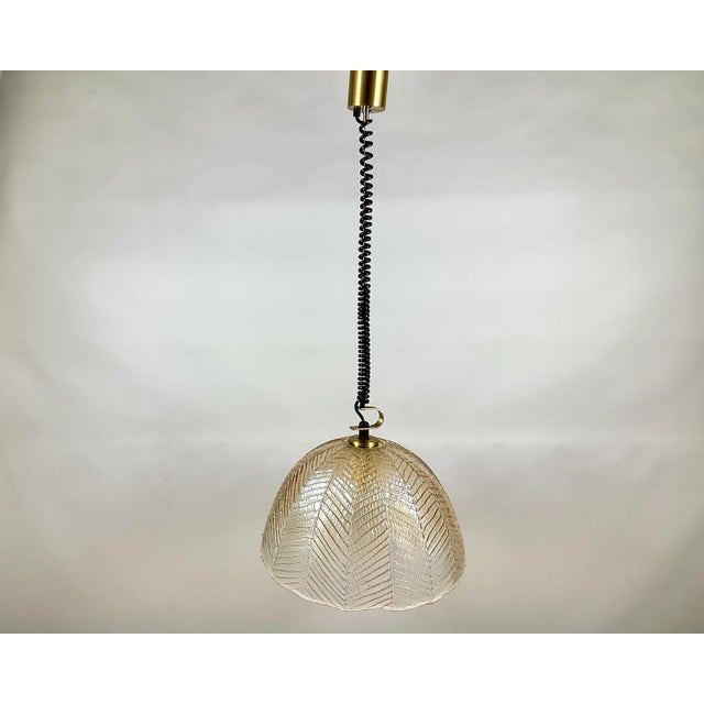 Vintage pendant lamp from the renowned German manufacturer, Peil & Putzler. This exquisite piece embodies the best of Mid-...