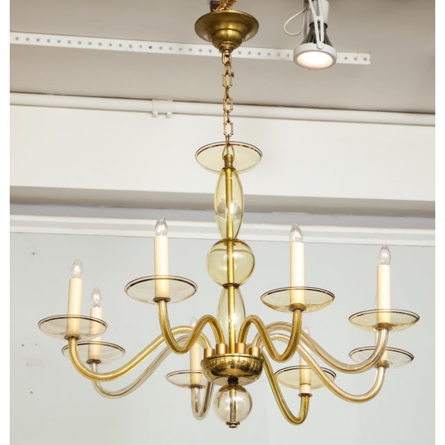 Eight arms amber-colored Murano glass chandelier.