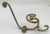 Elevate your space with this exquisite vintage French cast brass triple coat and hat hook from the early 1950s. This...