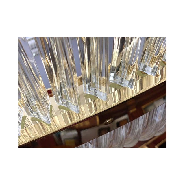 Impressive chandelier in gold 24k and clear triedrons. a jewel of hight italian craftmanship. luxury chandelier for modern...